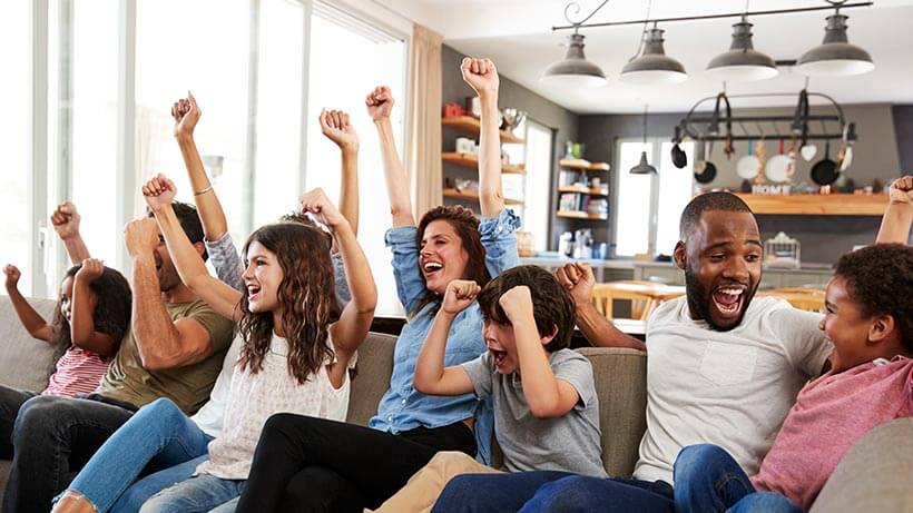 Family watching sports on a 4k TV