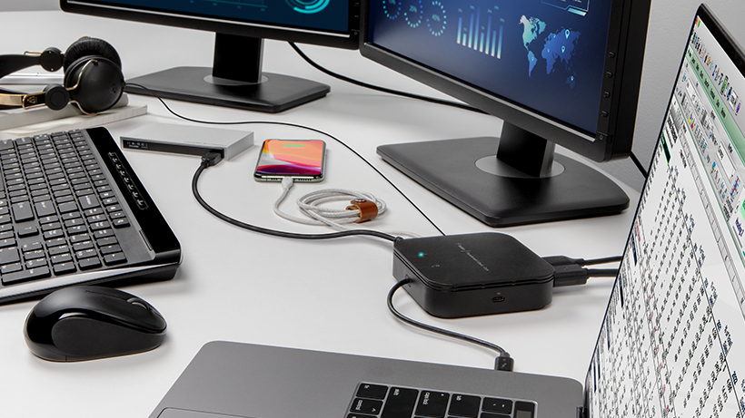 Multiple devices plugged into the Thunderbolt 3 Dock Core on a desk